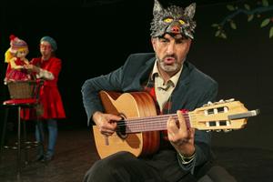 Un loup qui joue de la guitare